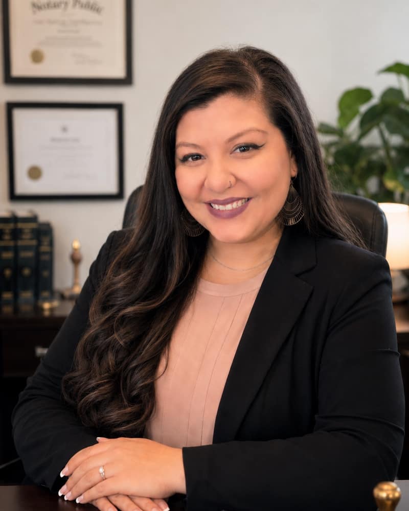 Jeannie Hernandez, commissioned Texas Notary Public for Legacy Notary Public, smiling in professional attire